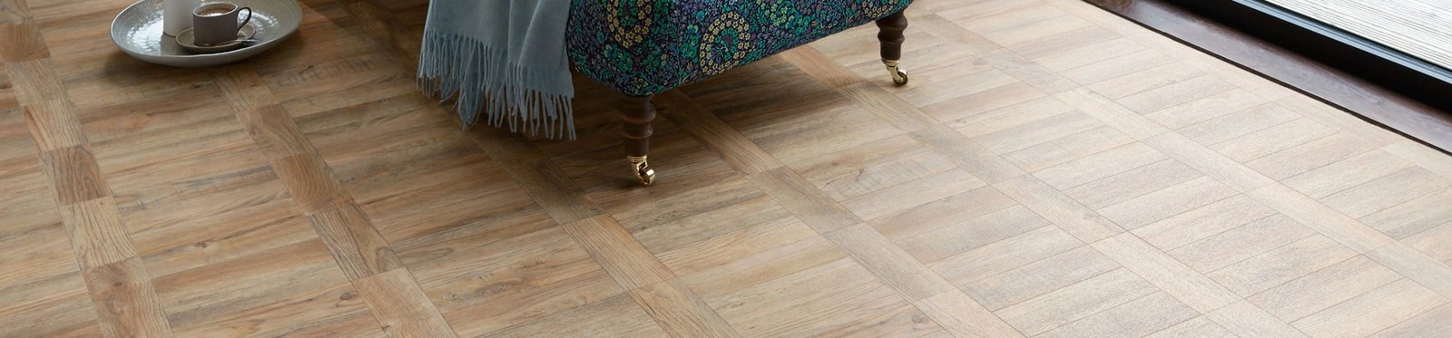 Premium basketweave parquet flooring in light wood tones with elegant room decor
